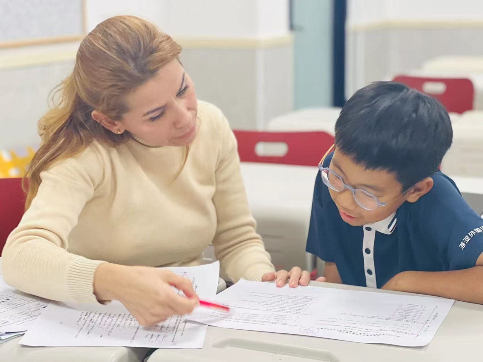 Teacher with a student Teacher giving a one-on-one lesson to a student