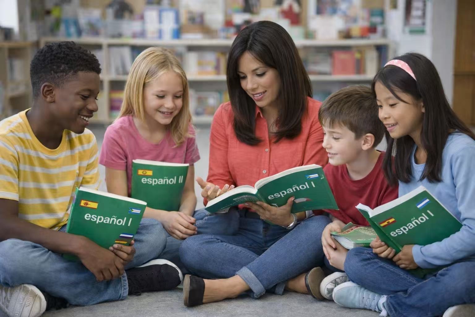 Little class Children learning Spanish around a teacher